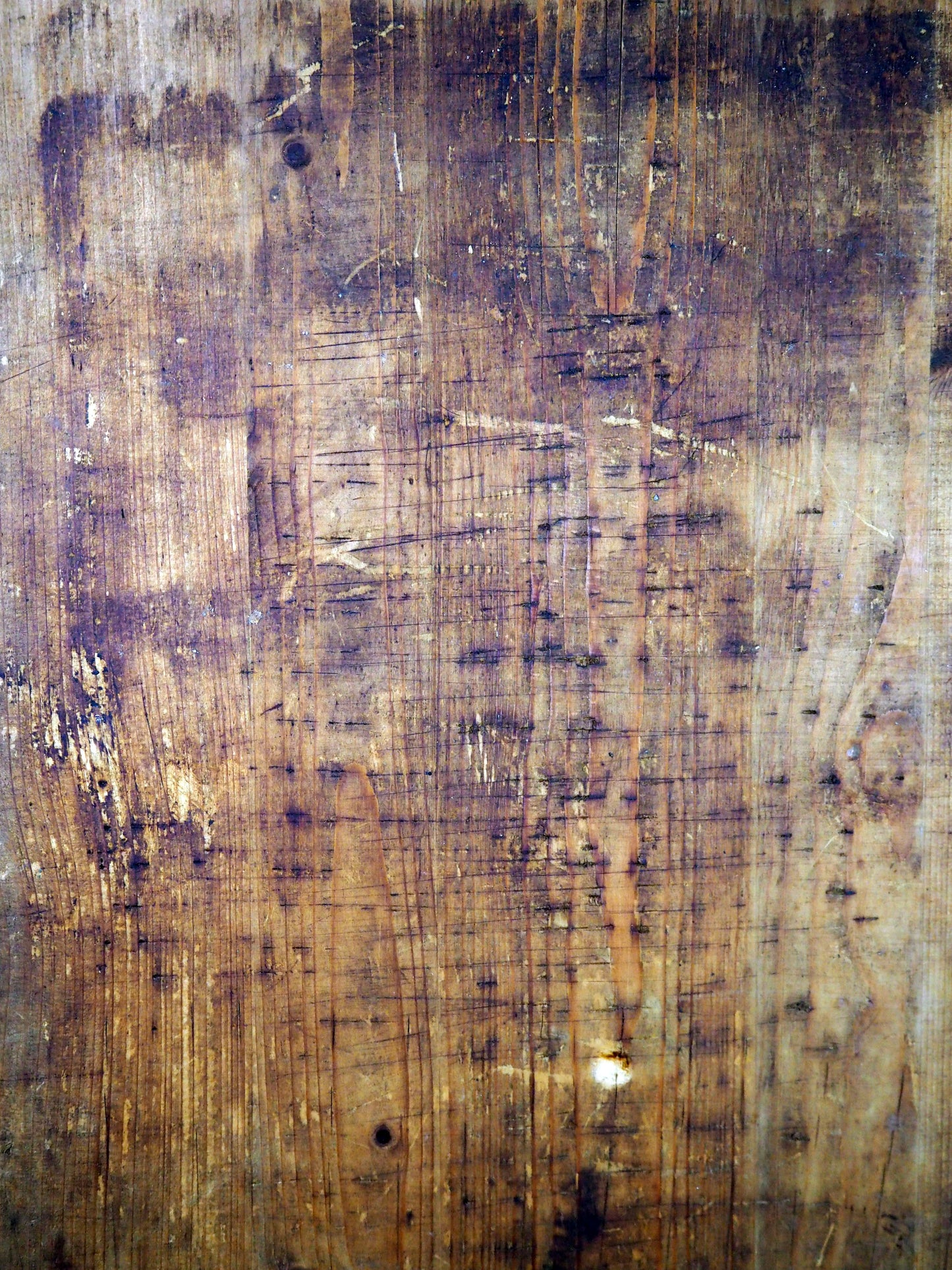 Textured brown surface with visible wear and tear