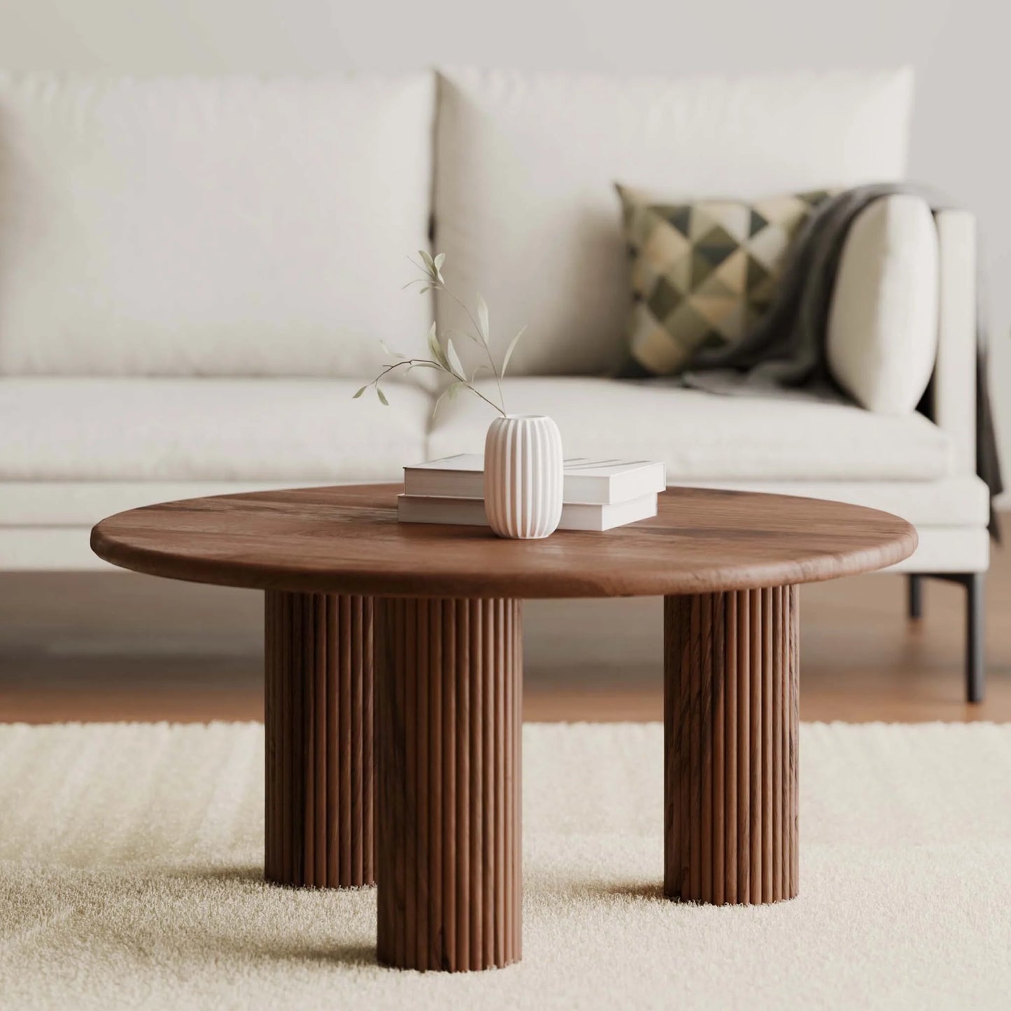 Wooden coffee table with decorative items in a living room setting