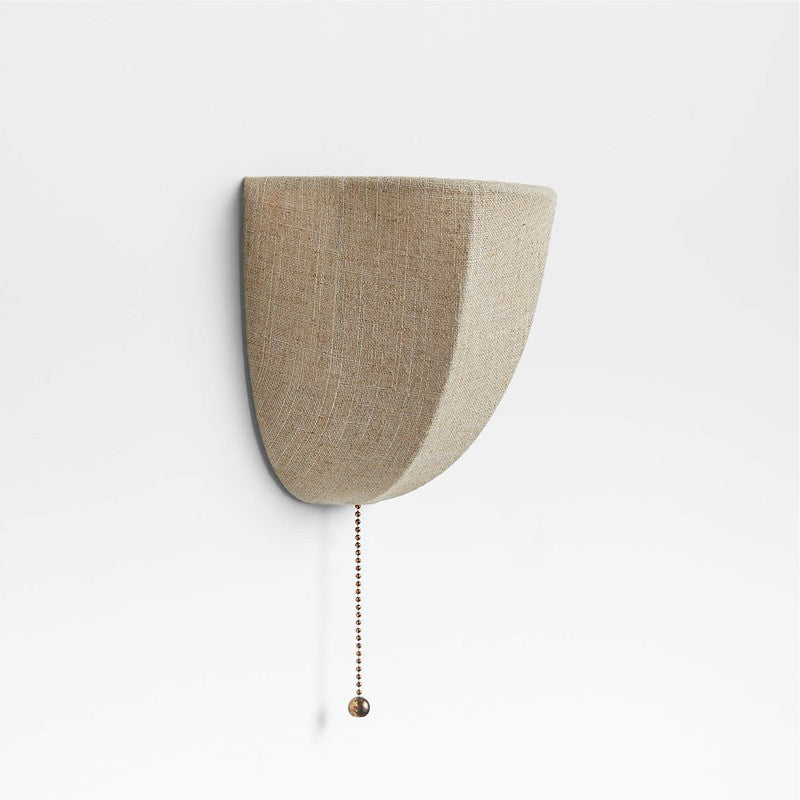 Half-moon shaped wall-mounted light fixture with a beige fabric shade on a white background