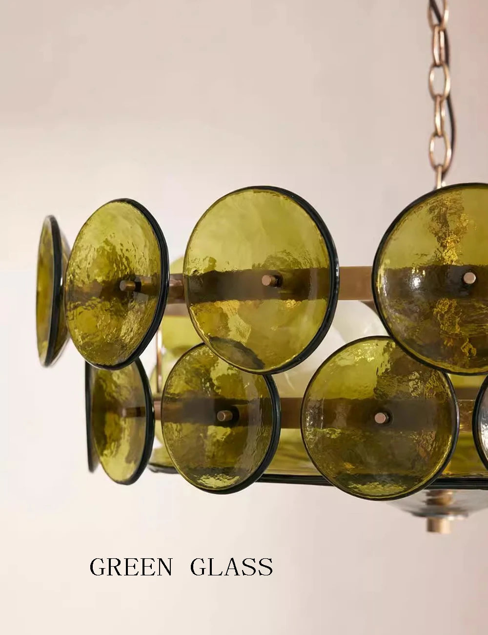 Chandelier with green glass shades on a neutral background