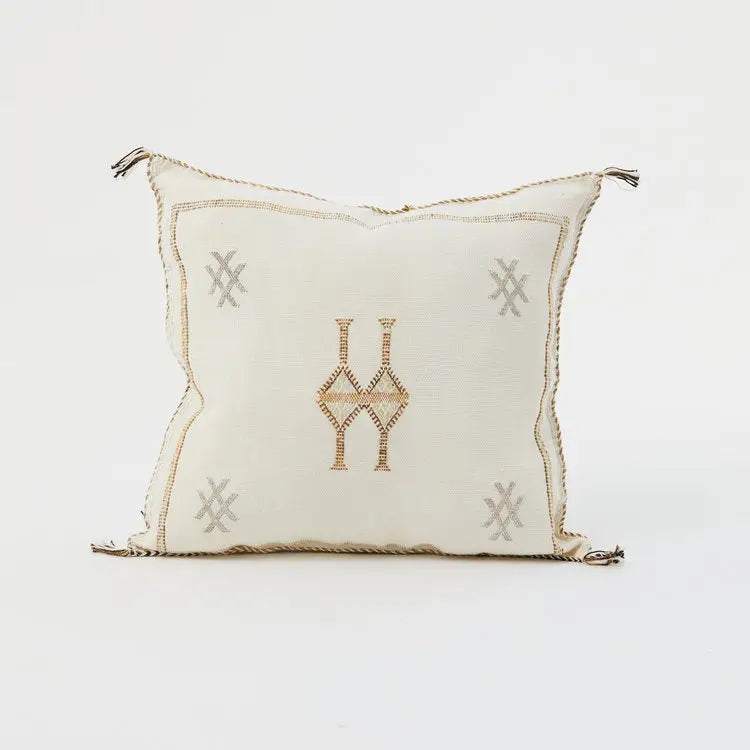 Decorative pillow with geometric patterns on a white background