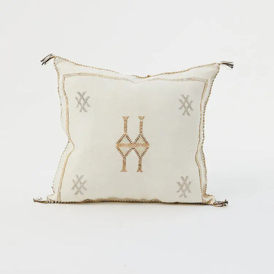 Decorative pillow with geometric patterns on a white background