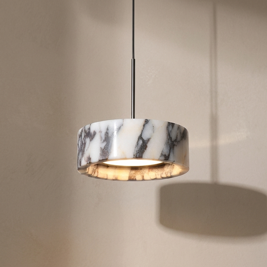 Marble Calcutta pendant light on a neutral background