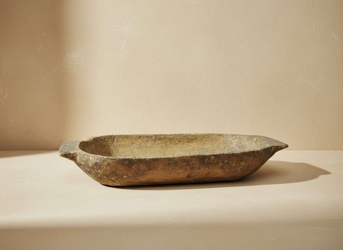 Vintage wooden dough bowl on a gray background