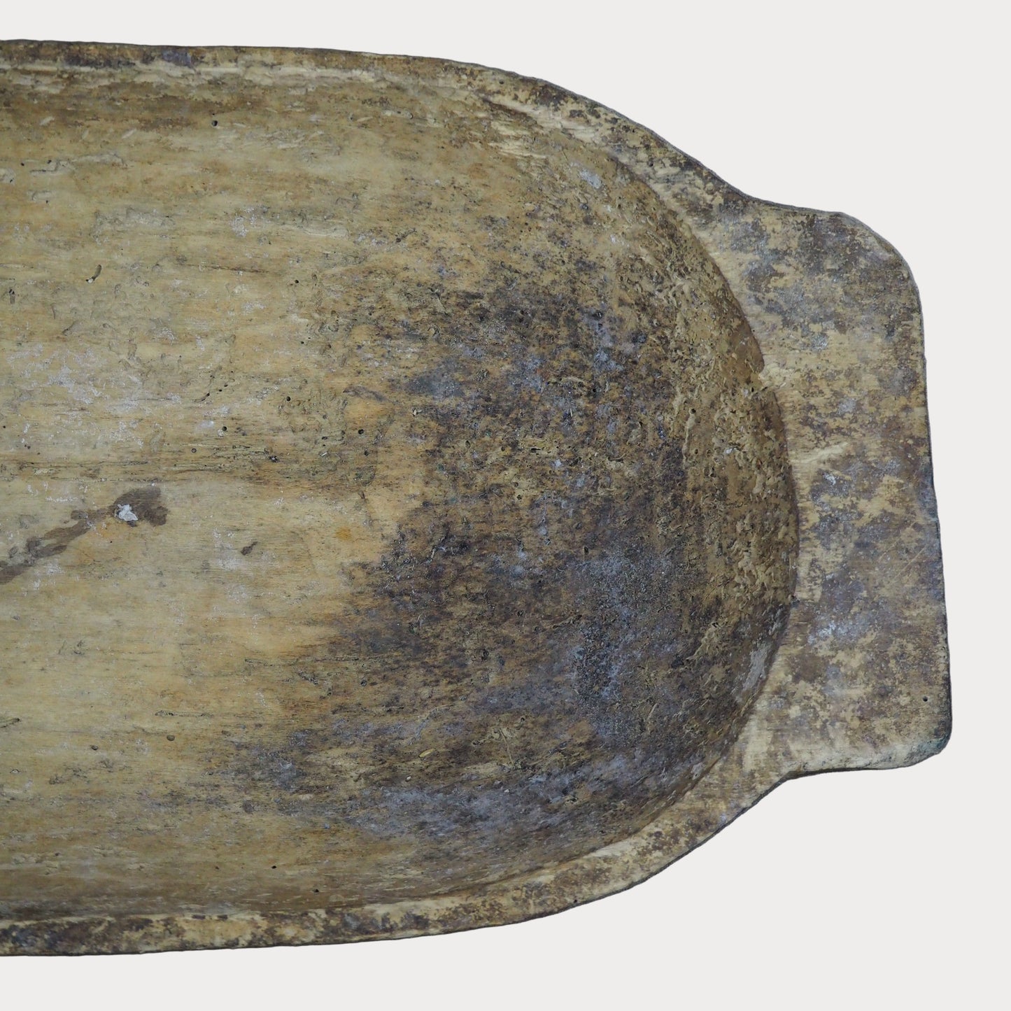 Weathered wooden bowl on a gray background