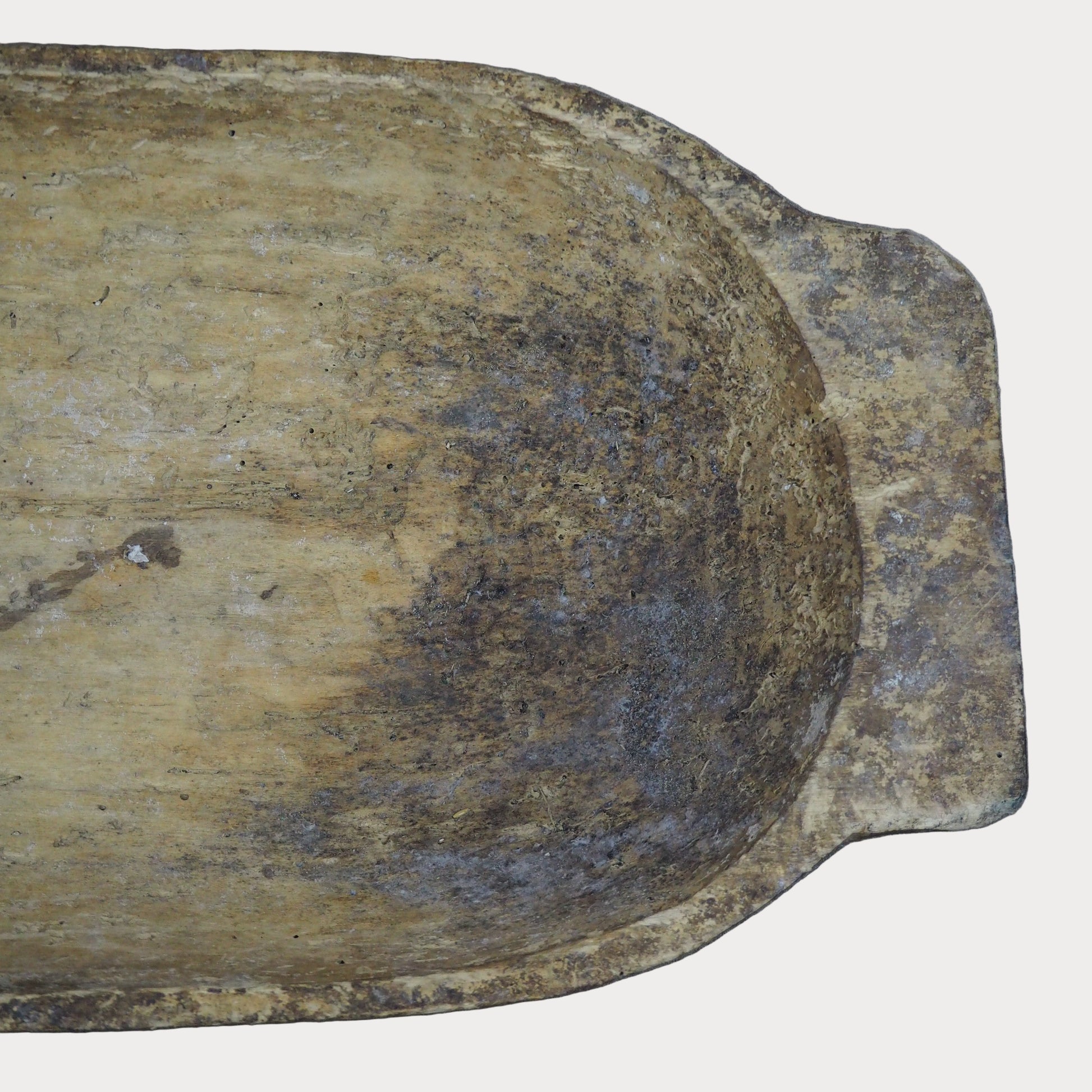 Weathered wooden bowl on a gray background