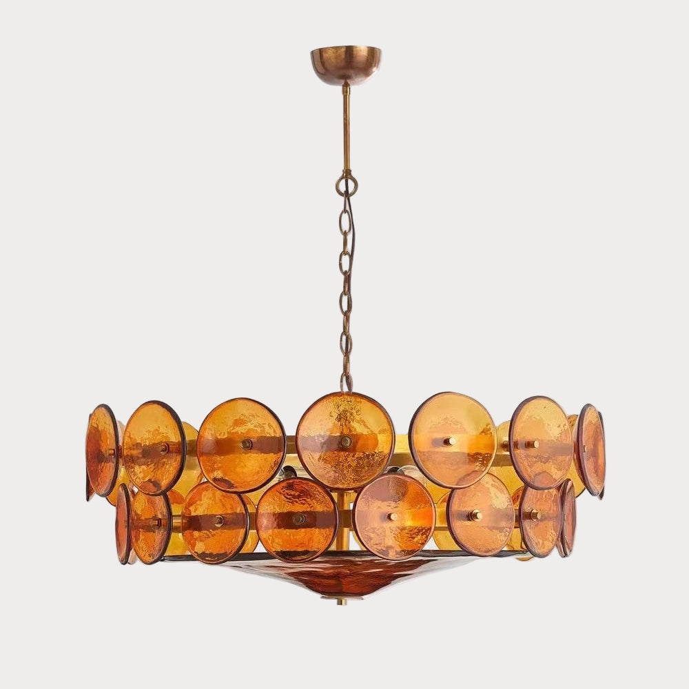Chandelier with amber-colored glass shades on a light gray background
