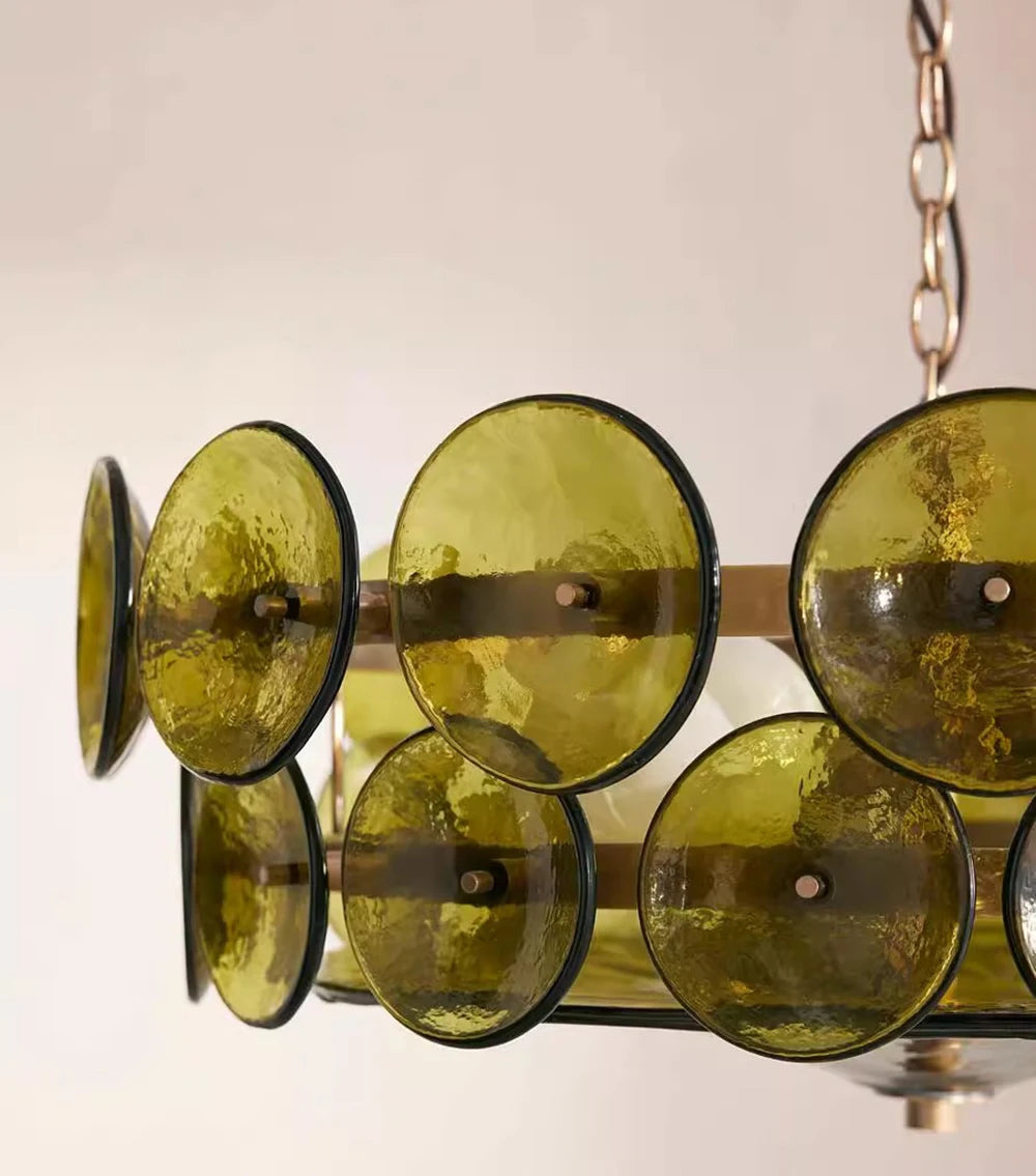 Chandelier with green glass shades on a neutral background
