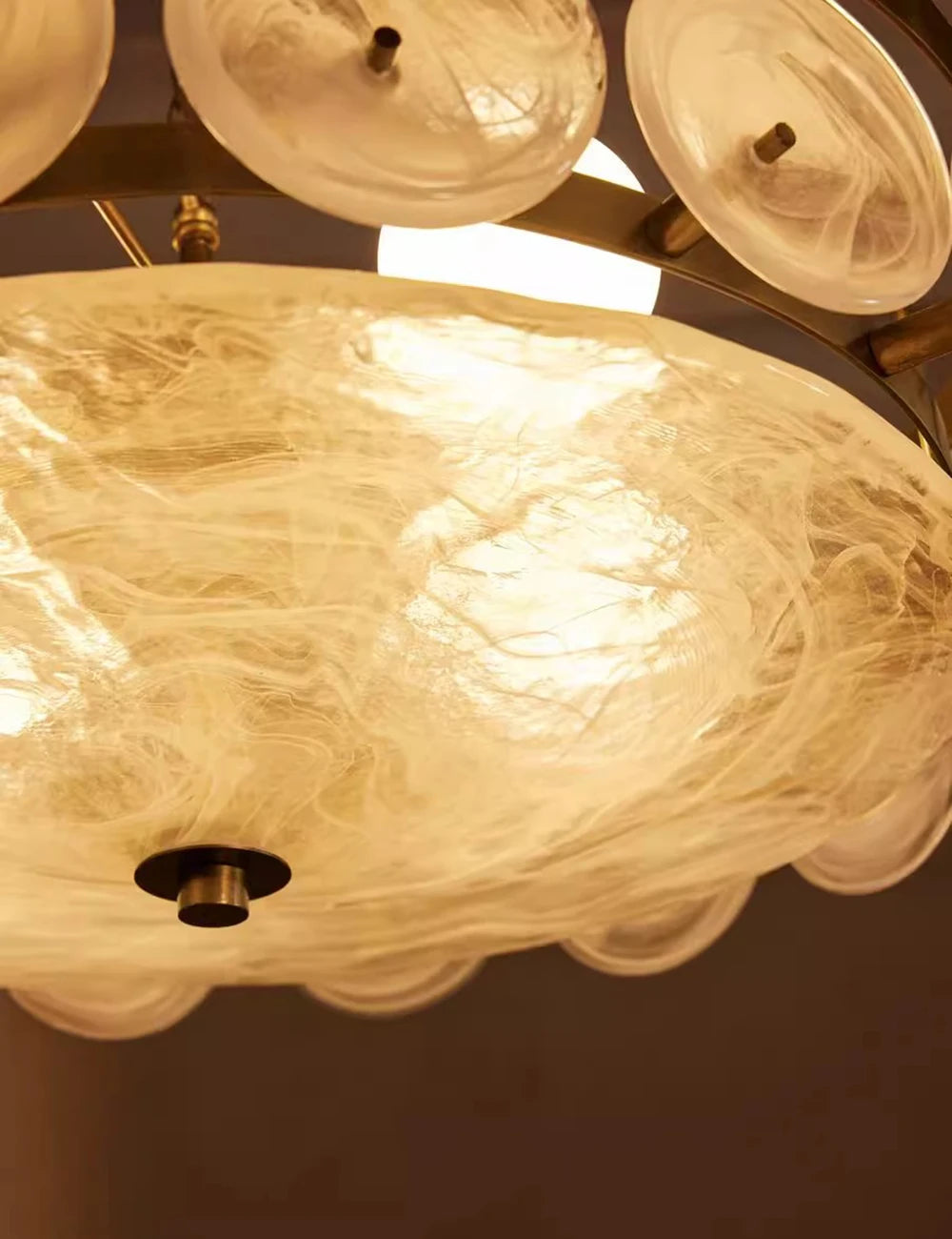 Close-up of a ceiling light fixture with glass shades