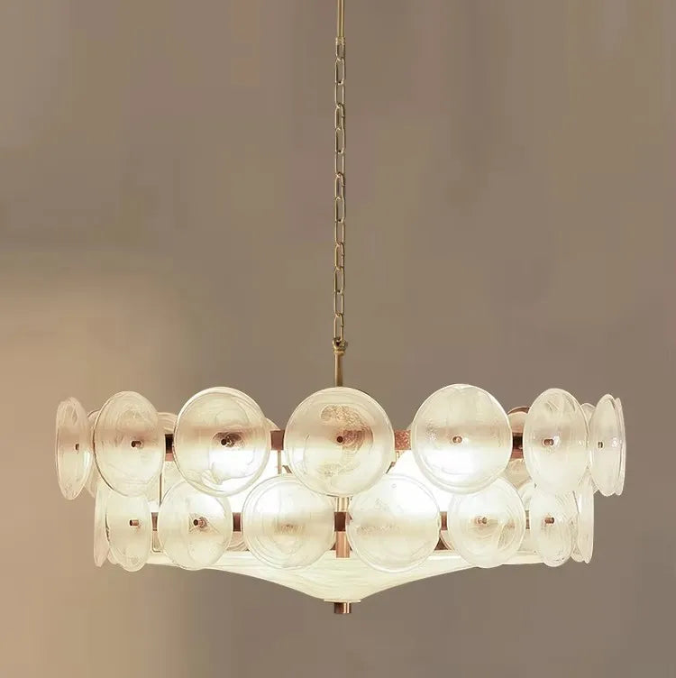 Modern chandelier with glass shades on a neutral background