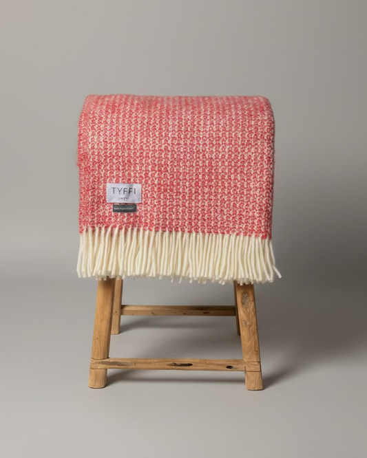 Pure Wool Heirloom Blanket Folded on stool 