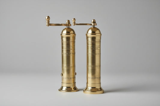 Two brass salt and pepper mills