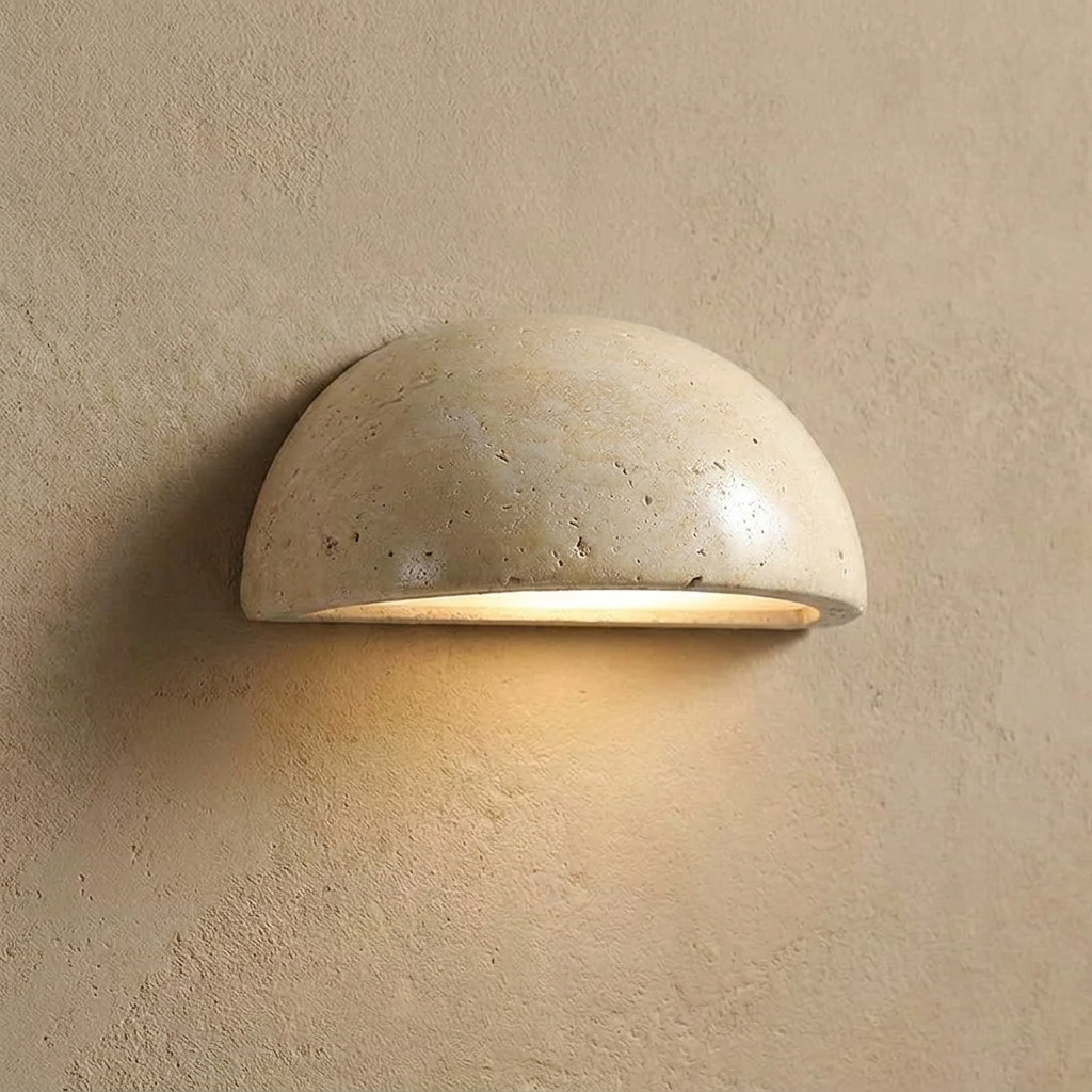 Travertine wall light fixture on a beige wall