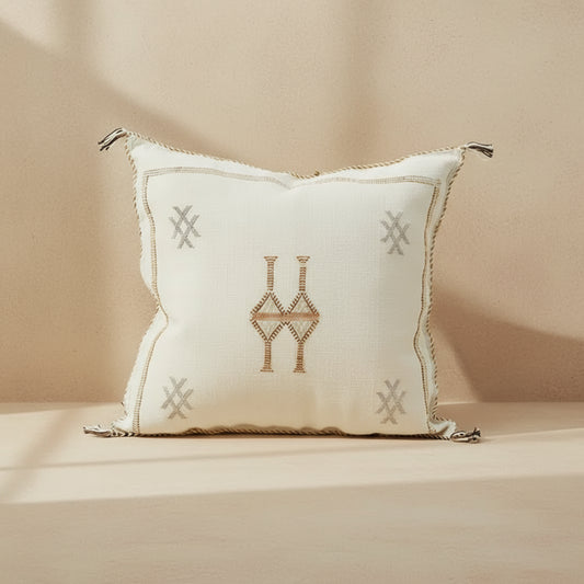 Decorative pillow with geometric patterns on a white background