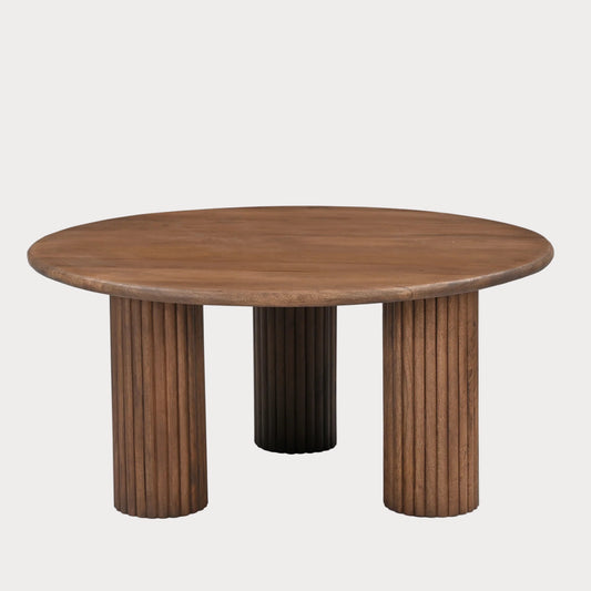Round wooden table with column-like legs on a white background