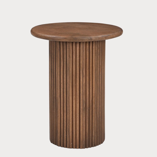 Wooden side table with a round top and ribbed cylindrical base on a white background