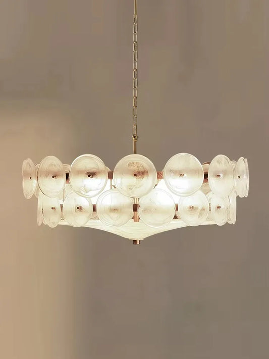 Modern chandelier with glass shades on a neutral background