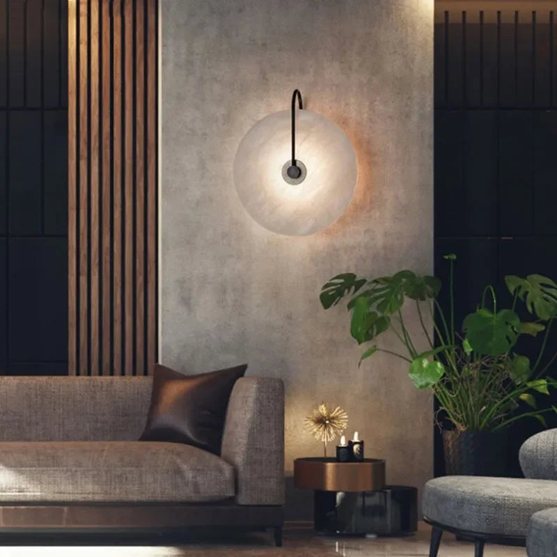 ORBIT | Circular sconce with black detailing.