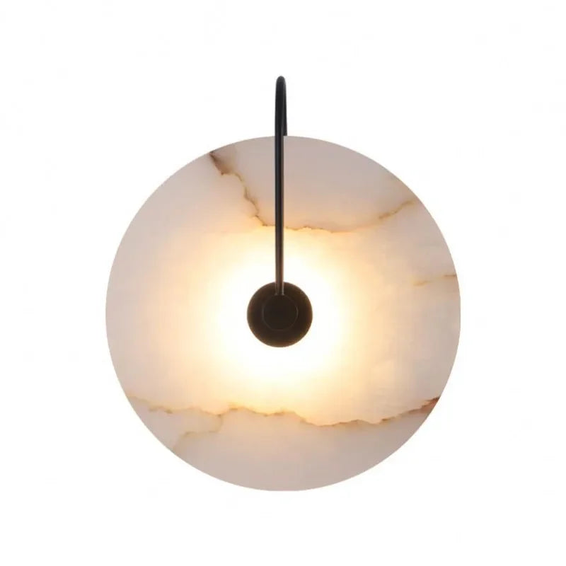 ORBIT | Circular sconce with black detailing.