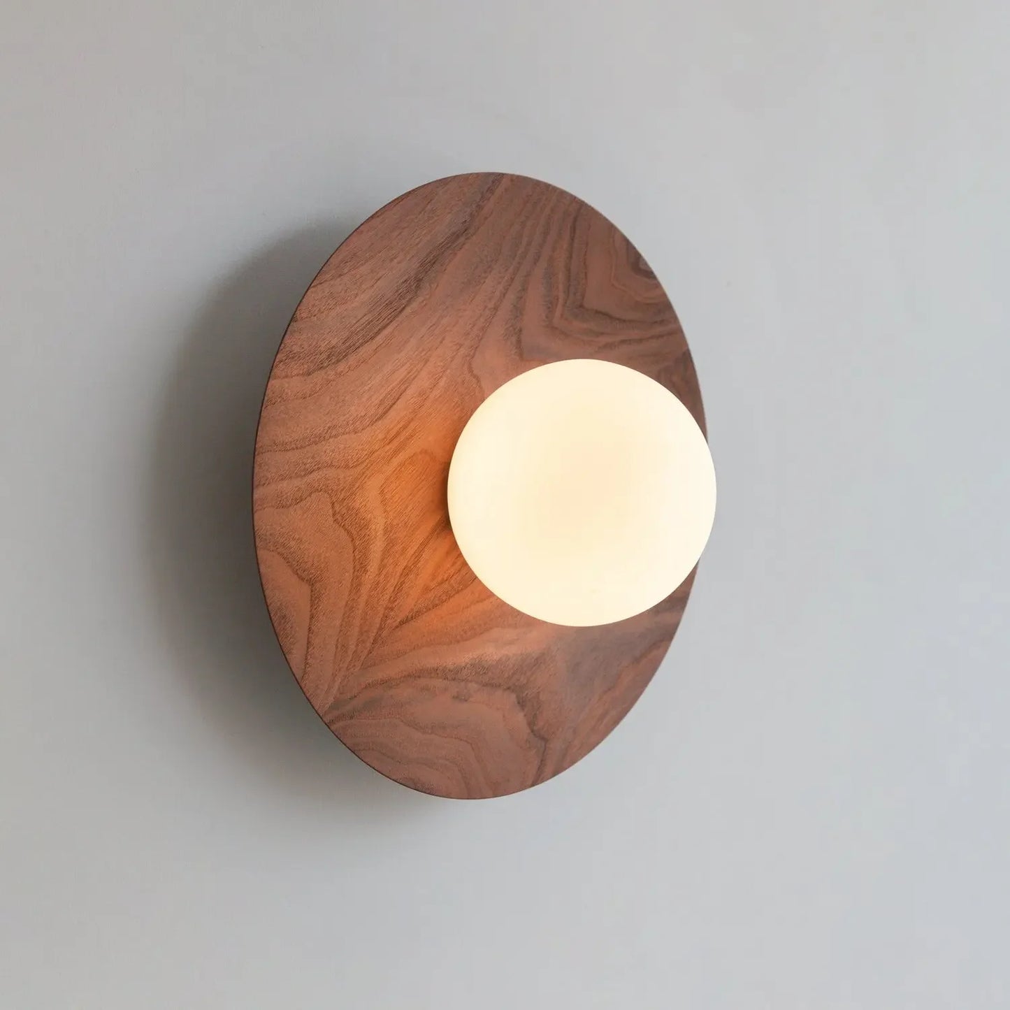 Walnut wall light with globe
