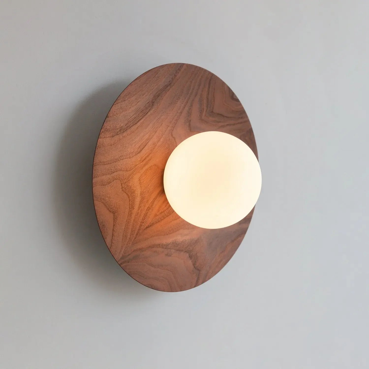 Walnut wall light with globe