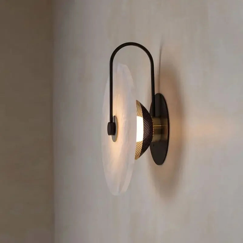 ORBIT | Circular sconce with black detailing.
