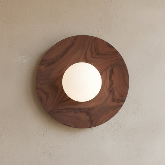 Wooden circular light fixture on a white background