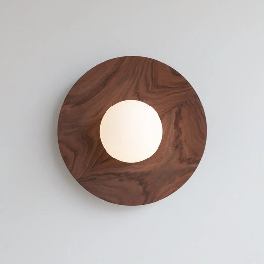Wooden circular light fixture on a white background