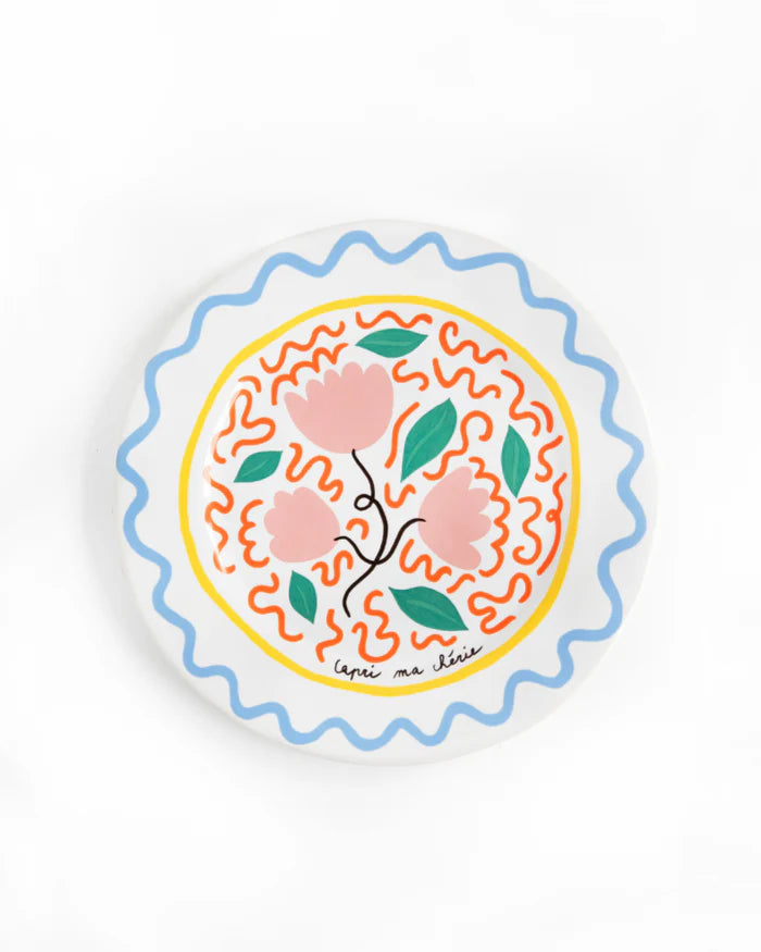 Decorative plate with floral design on a white background