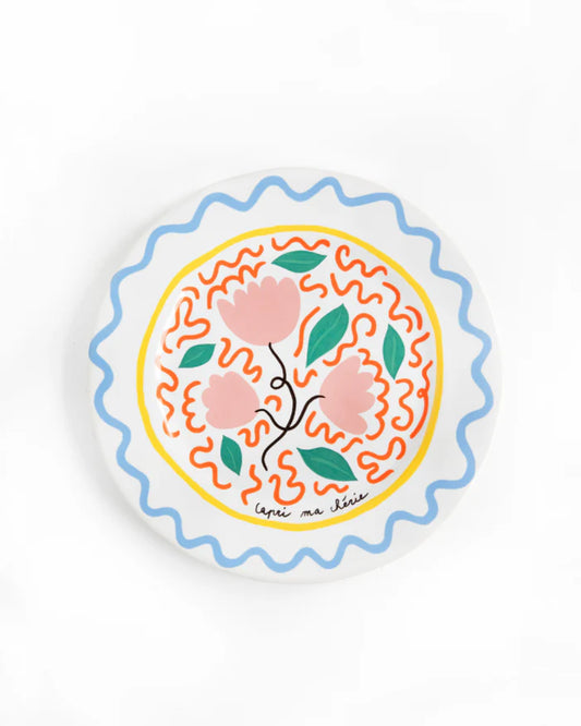 Decorative plate with floral design on a white background