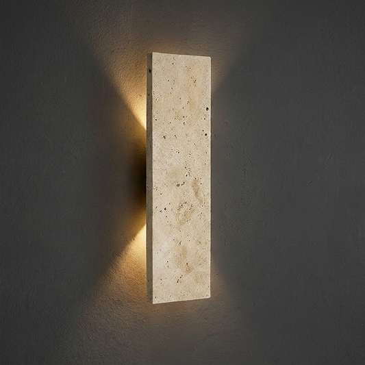 Rectangular stone wall light fixture on a dark wall