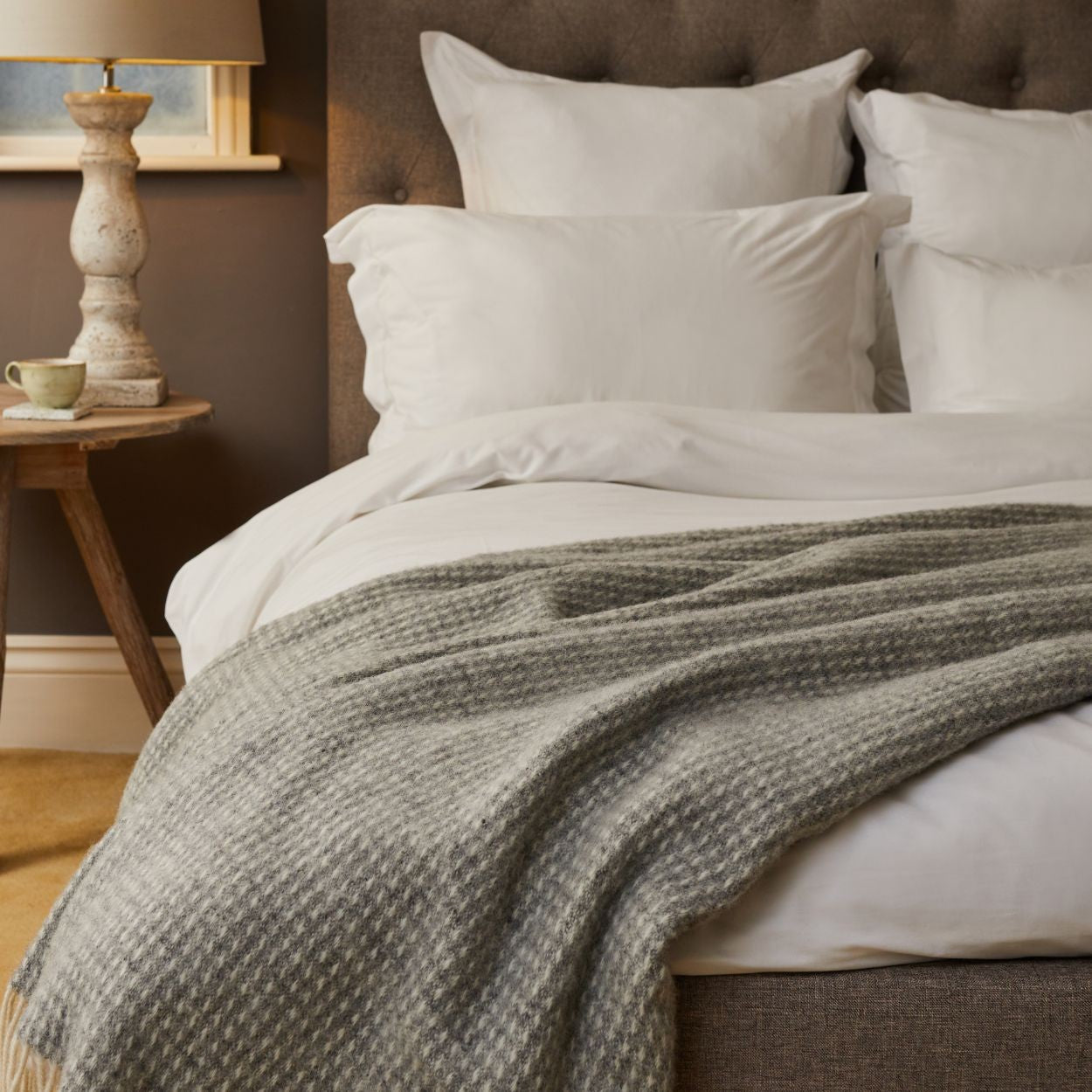 waffle grey throw blanket british pure new wool lifestyle photo on bed 