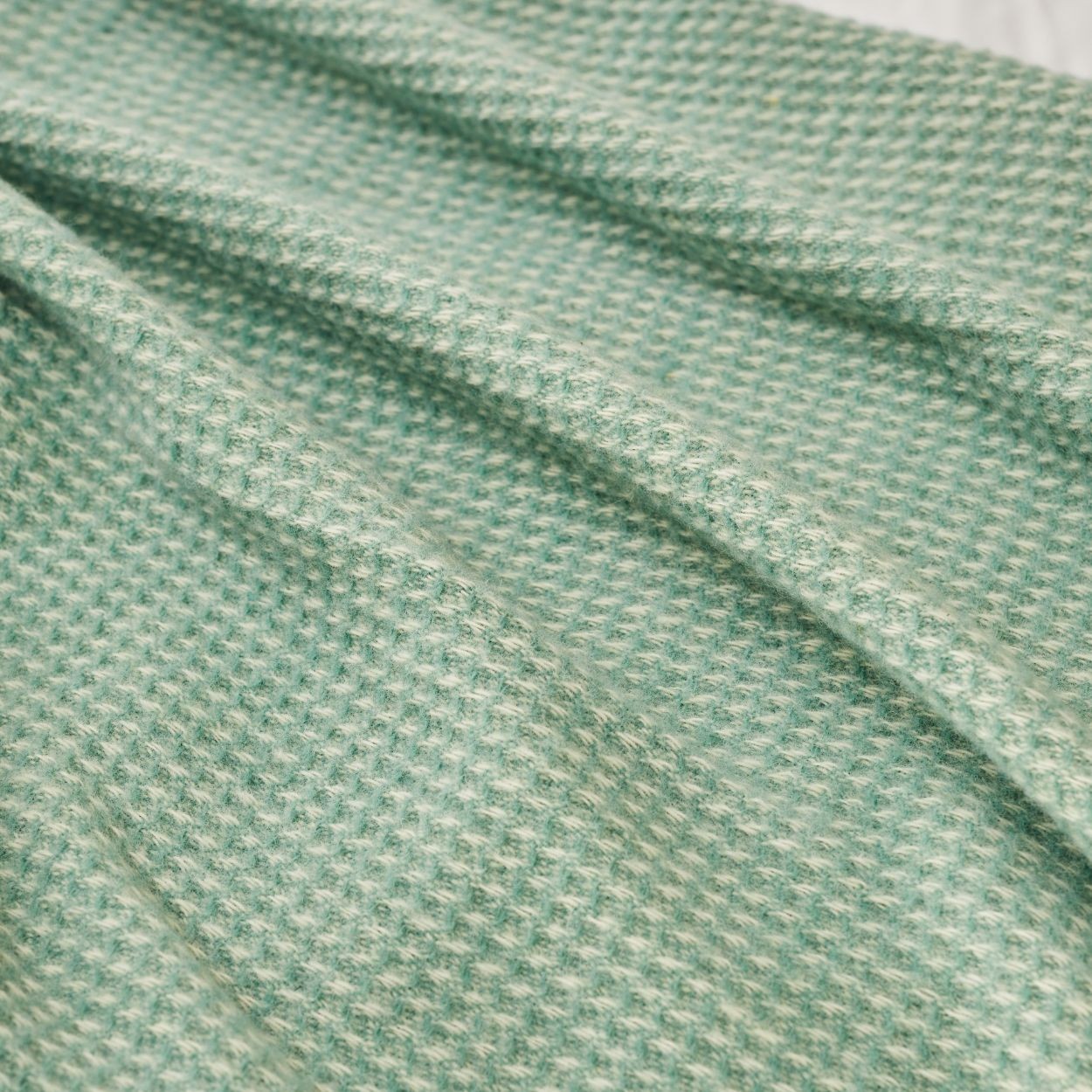 waffle sea green throw close up pure british new wool blanket 